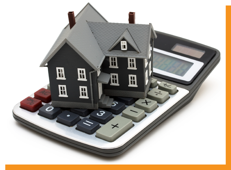 a conceptual image of a model home sitting on top of a calculator